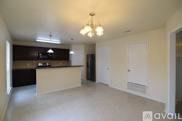 Killeen house for rent - A kitchen area with a counter and cabinets.