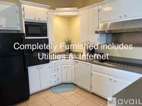Brownsville apartment for rent - A kitchen with white cabinets and appliances is available for rent.
