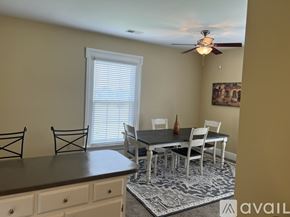 Brownsville apartment for rent - A dining room with a table and chairs.
