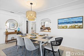 Jupiter apartment for rent - A dining room with a white table and grey chairs.