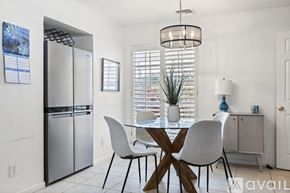Jupiter apartment for rent - A modern kitchen with a dining table and chairs.