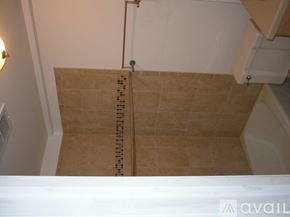 Chicago apartment for rent - A bathroom with a tiled shower area.