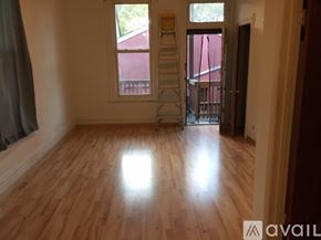 Chicago apartment for rent - A room with wooden flooring and a ladder in it.