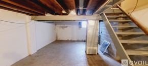 Canton townhouse for rent - A room with a staircase leading to the upper floor.