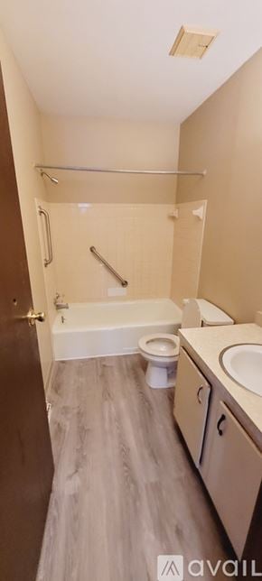 Canton townhouse for rent - A bathroom with a toilet, sink, and shower.