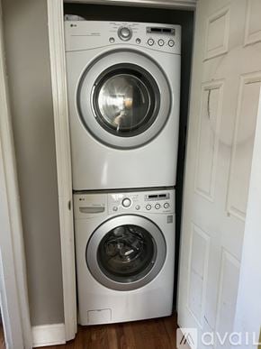 Nashville house for rent - A white washing machine and dryer stacked on top of each other in a small space.