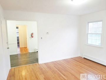 Hackettstown apartment for rent - A kitchen with a black refrigerator and stainless steel dishwasher.