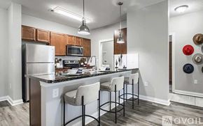Powell apartment for rent - A kitchen with a white counter top and a black bar stool.