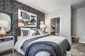 Powell apartment for rent - A bedroom with a large bed and a painting on the wall.