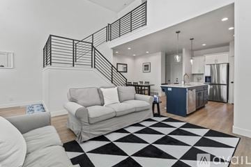 Lehi apartment for rent - A black and white checkered rug is on the floor of a modern living room.