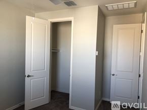 Gilbert apartment for rent - A room with two doors, one of which is open.
