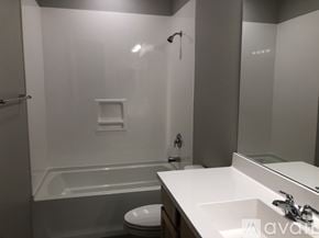 Gilbert apartment for rent - A bathroom with a white sink, toilet, and bathtub.
