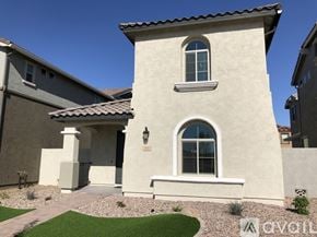 Gilbert apartment for rent - A beige house with a window and a door.