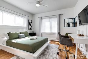 Miami apartment for rent - A bedroom with a bed, desk, and chair.