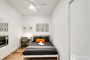 Miami apartment for rent - A bedroom with a bed, desk, and chair.