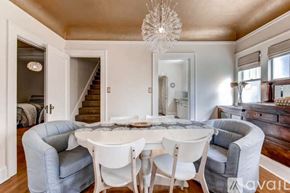 Portland house for rent - A dining room with a round table and chairs.