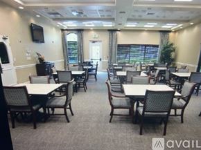 Fort Myers house for rent - A conference room with multiple tables and chairs.