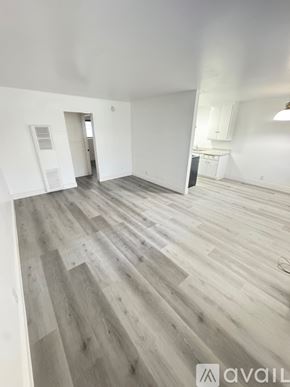 Azusa apartment for rent - A room with wooden flooring and a window with blinds.