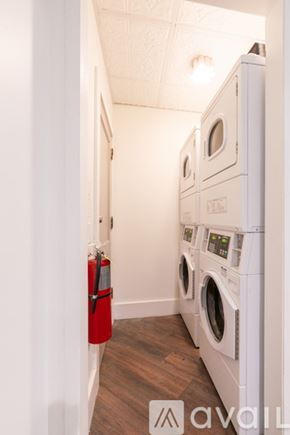 Altoona apartment for rent - A row of white washing machines in a laundry room.