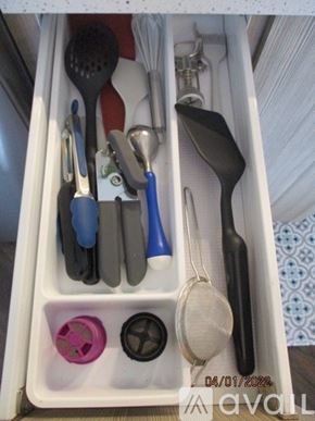 Altoona apartment for rent - A drawer full of utensils including spoons, spatulas, and tongs.