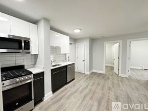 Chicago apartment for rent - A kitchen with a stove, oven, and microwave.