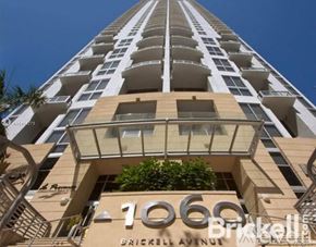 Miami apartment for rent - A tall building with the number 1068 on it.