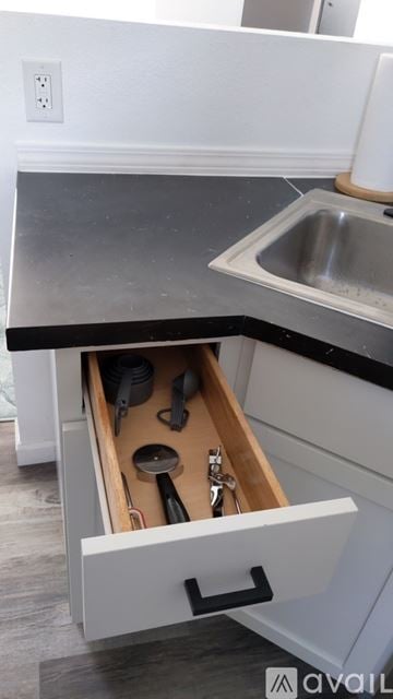 Bremerton house for rent - A kitchen drawer with utensils in it.