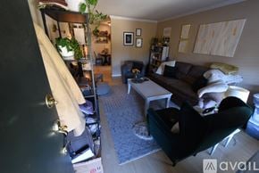 Birmingham apartment for rent - A living room with a couch, chair, and a coffee table.