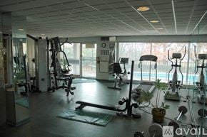 Birmingham apartment for rent - A gym with a variety of equipment including treadmills, weights, and exercise machines.