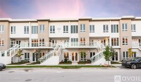 Doral apartment for rent - A row of townhouses with a car parked in front.