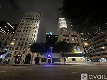Los Angeles apartment for rent - A kitchen with a long counter and a refrigerator in the background.