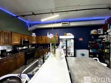 Los Angeles apartment for rent - A kitchen with a long counter and a refrigerator in the background.