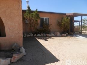 Landers apartment for rent - A house with a brown exterior and a white chimney.