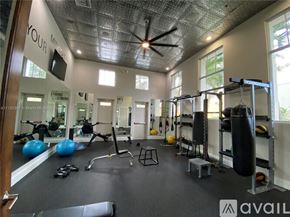 West Palm Beach townhouse for rent - A gym with a variety of equipment including a punching bag.