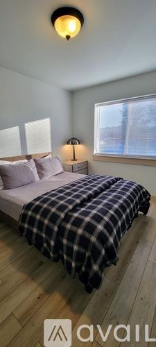 Neotsu house for rent - A bedroom with a bed and a window.