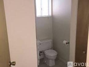 Placentia apartment for rent - A small bathroom with a toilet and a sink.