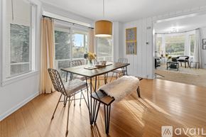 Tacoma apartment for rent - A dining room with a table set for four and a view of the backyard.