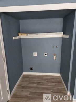 San Antonio apartment for rent - A small room with a white shelf and a door.