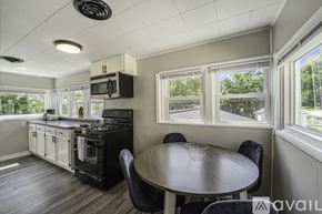 Grand Rapids apartment for rent - A kitchen with a table and chairs and a window.