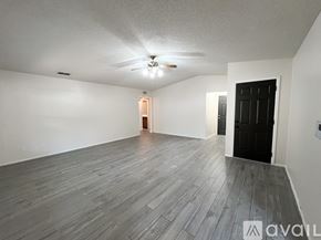 Overton apartment for rent - A kitchen with wooden cabinets and a tile floor.