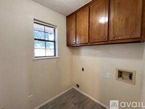 Overton apartment for rent - A spacious room with a ceiling fan and wooden flooring.