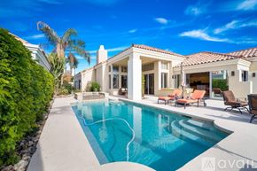 La Quinta house for rent - A large house with a pool in the backyard.