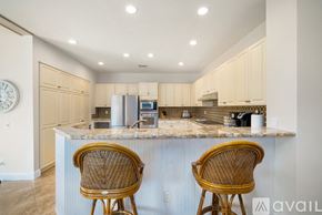 La Quinta house for rent - Two chairs are placed in front of a kitchen island.
