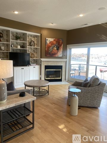 Stillwater apartment for rent - A living room with a fireplace and a painting on the wall.