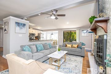 Jacksonville house for rent - A living room with a grey couch and a coffee table.