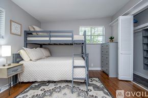 Jacksonville house for rent - A bedroom with a bunk bed and a dresser.