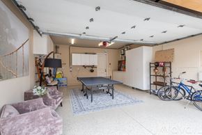Huntington Beach house for rent - A room with a pool table, chairs, and bicycles.