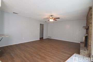Killeen house for rent - A living room with a television and a ceiling fan.