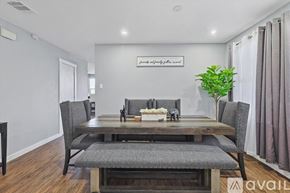 Grand Prairie house for rent - A dining room with a wooden table and chairs.