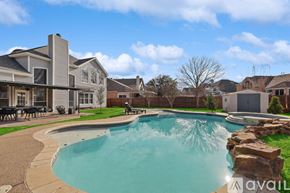Haltom City house for rent - A large swimming pool in a backyard with a house in the background.